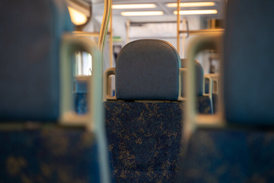 Interior view of empty passenger train seats.
