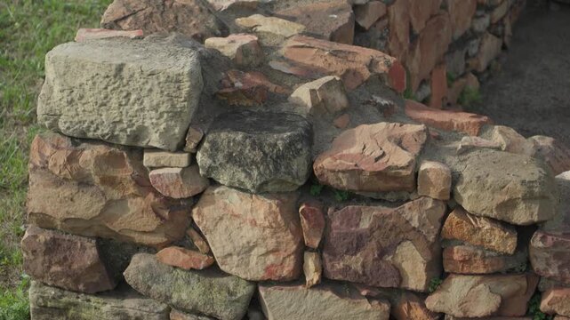 Detail of a historic rock wall at the Campa Torres Archaeological Natural Park in Gijon