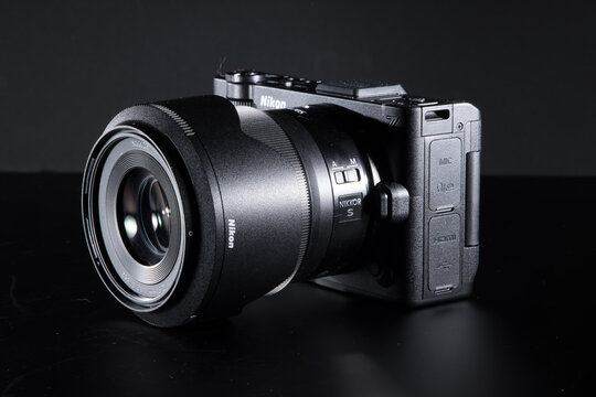 Milan, Italy - August 31, 2026: studio shot of a Nikon ZR resting on a black background.