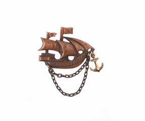 Sailing ship brooch isolated on white background © serikbaib