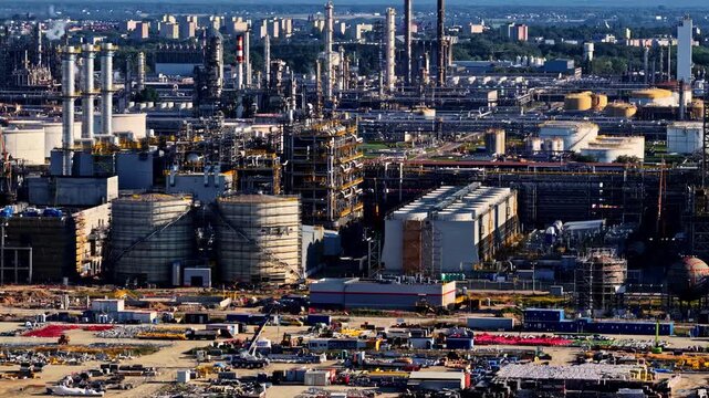 Aerial view of the Orlen Plock Production Plant featuring large storage tanks, industrial infrastructure, and complex piping systems in Plock, Wojewodztwo mazowieckie, Poland.
