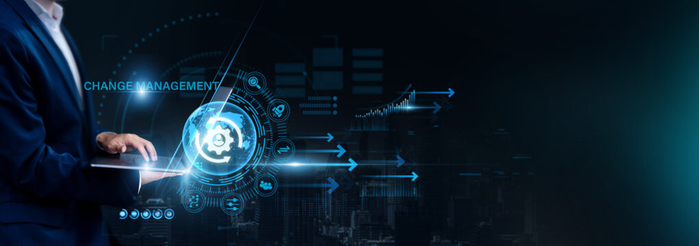 Businessman using laptop for analyzing Change Management and global business data, organizational transformation, process improvement, strategic planning, business growth.