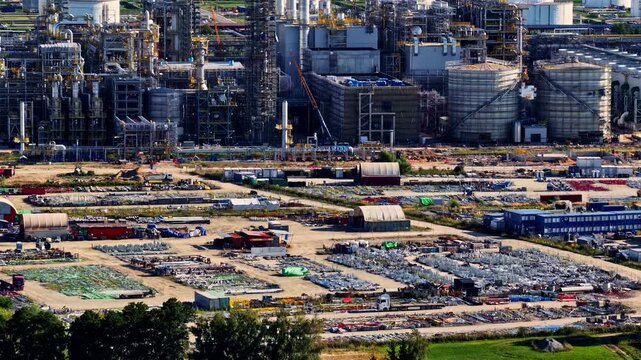 Aerial view of the Orlen Plock Production Plant featuring industrial infrastructure, storage tanks, and extensive storage yards in Plock, Mazowieckie Voivodeship, Poland.