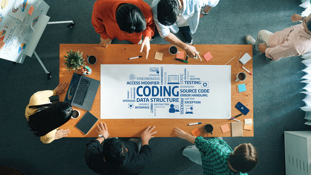 Collaborative Coding Session with Diverse Group Analyzing Data Structures and Source Code Using Diagrams and Notes on a Table in Modern Office Environment. Amity