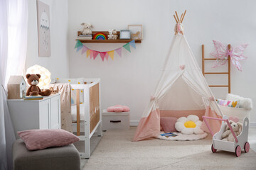 Crib, wigwam and other toys in baby's room. Interior design © New Africa