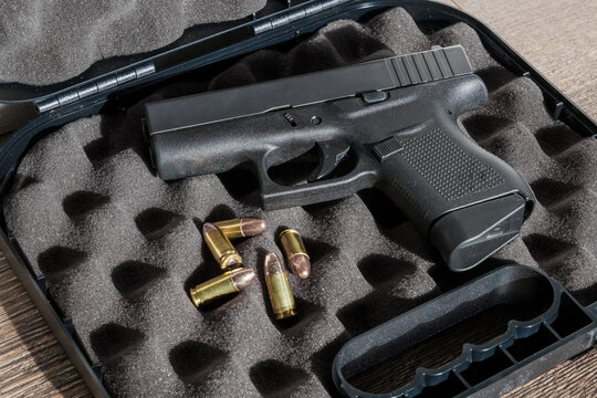Glock Pistol with Loose Ammunition in Foam Lined Case