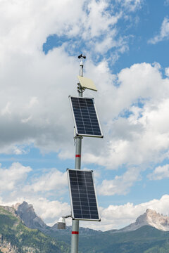 Val di Zoldo, Italy. Solar-powered weather monitoring station against the Dolomites