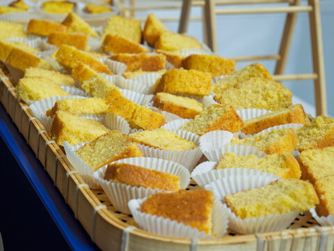 Golden Yellow Cake Slices Displayed in Bakery
