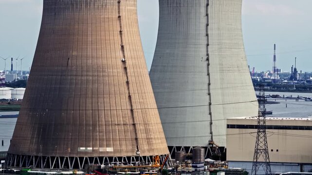 Aerial view of Doel Nuclear Power Station cooling towers near the river Scheldt in Beveren-Kruibeke-Zwijndrecht, Vlaanderen, Belgium.