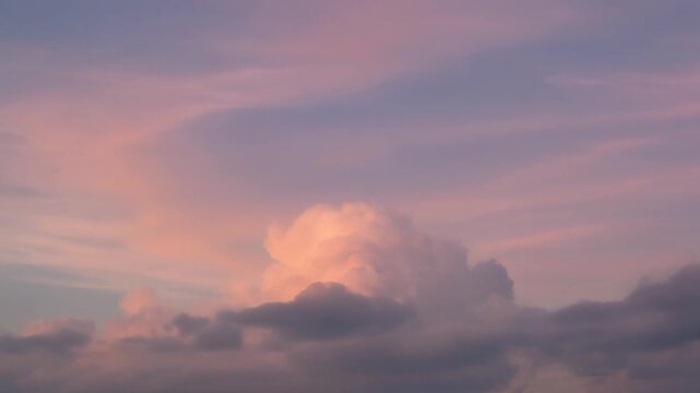 Pastel Pink and Purple Sunset Clouds, Soft Sky Background, Serene Atmosphere