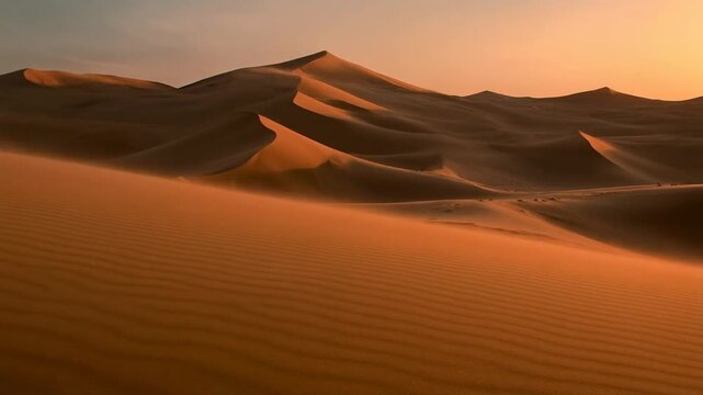 Golden Desert Sand Dunes at Sunset, Wind Blowing Sand Across Landscape