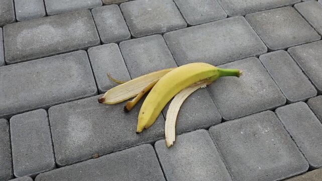 Bunch of bananas resting on a stone surface