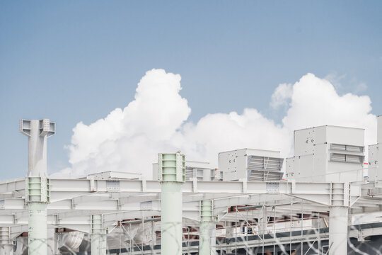 View of industrial HVAC units mounted on a white steel frame structure at Tirana International Airport, Rinas, Albania.