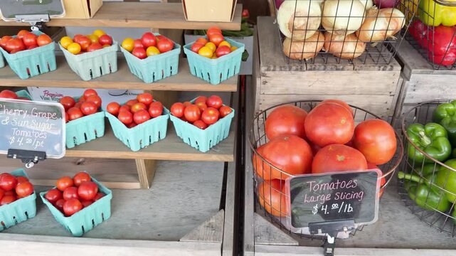 Fresh produce for sale includes tomatoes, onions, bell peppers, cherry tomatoes, pineapple, hot peppers and grape tomatoes