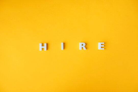 Hiring, recruitment and employment concept with HIRE letters and copy space