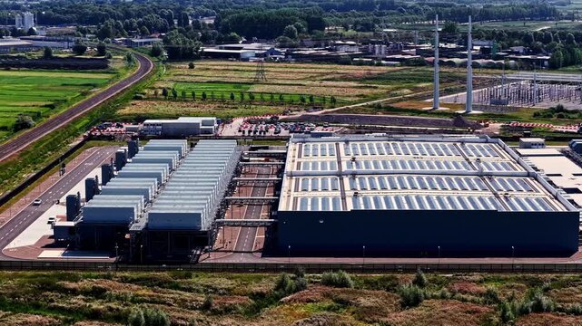 Aerial view of the Google Westpoort Data Center featuring large industrial buildings, rooftops, and surrounding infrastructure in Groningen, Groningen, Netherlands.