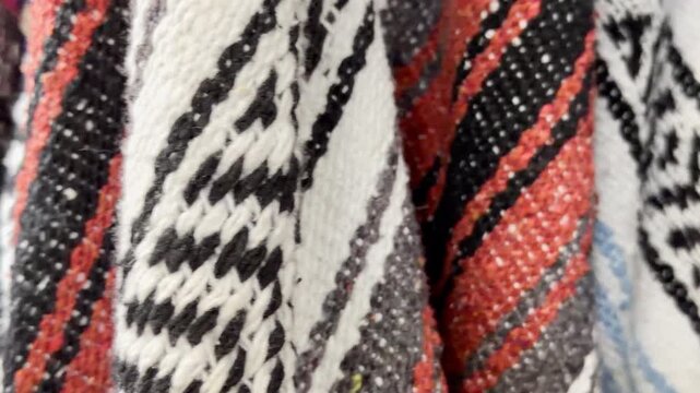 Woven traditional jerga textile with bold, colorful patterns.