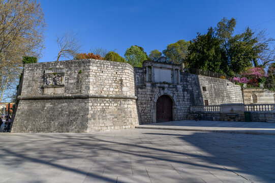 Stone bastion of the old city walls with carved coats of arms, Zadar, Croatia