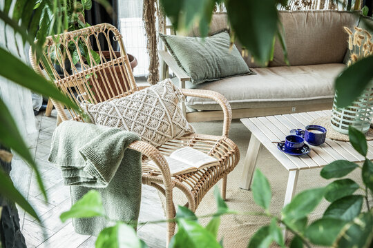rustic greenhouse reading nook with tropical foliage for concepts of comfort  serenity and eco-friendly interior