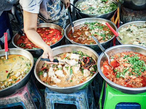 delicious fresh street food in Thailand - top view - Thai Curry, Tamarind, Tom Yam, Shrimp, Pork, Pad Thai
