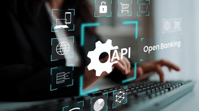 Professional and Modern Businesswoman Working on Keyboard Surrounded by Digital Icons Representing API and Open Banking Concepts in a Tech Environment Gluon.