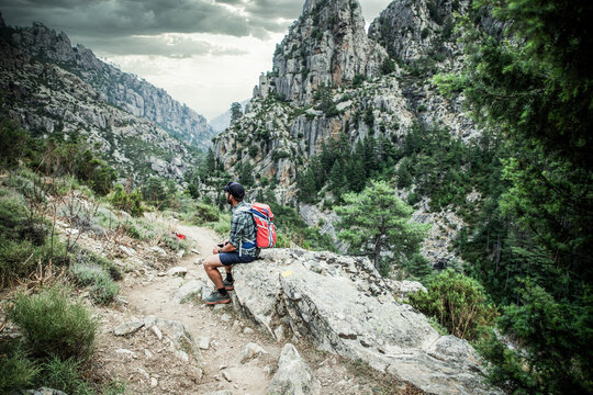 man hiker relaxing in the mountains