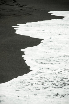 abstract wall art of black sand and sea waves