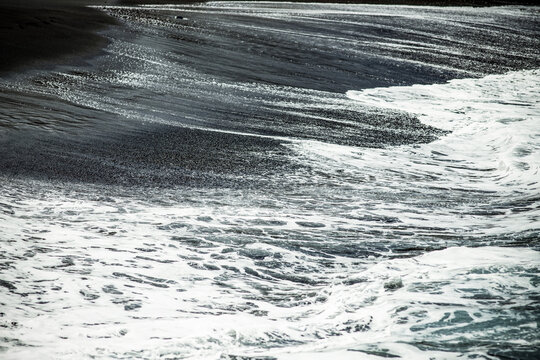 abstract wall art of black sand and sea waves