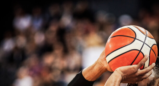 basketball player shooting three pointer