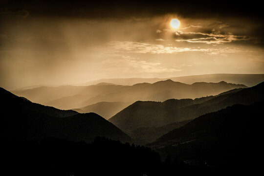 banner of mountain peaks in beautiful stormy sunset light