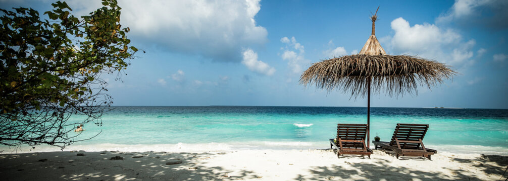 beach chairs on beautiful tropical beach
