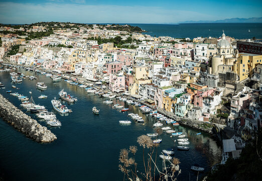 panoramic view of Coricella town, sea and castle  on beautiful Procida island with colorful houses in sunny summer day  Italy