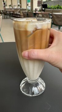Serving a Delicious Cold Iced Latte Coffee