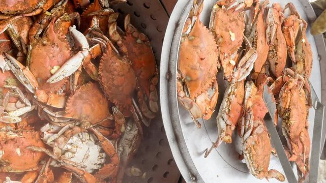 Freshly steamed crabs ready and removed to serve to an anxiously waiting crowd.