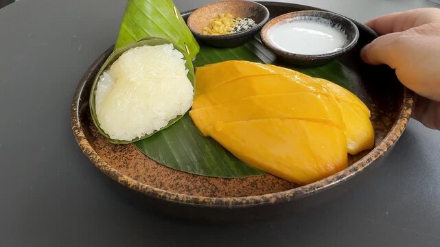 Serving a Place of Mango and Sticky Rice