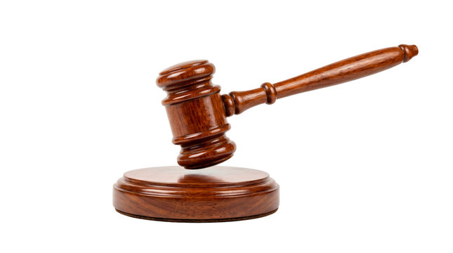 Polished dark wooden judge gavel resting on round sound block made from rich mahogany timber shown on transparent background