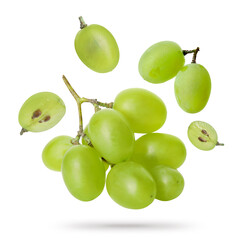 Green grapes flying in air against white background