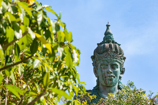 Landscape picture of old Wisnu Kencana GWK statues as  Bali landmark with blue sky as a background. Balinese traditional symbol of hindu religion. Popular travel destinations in Indonesia.