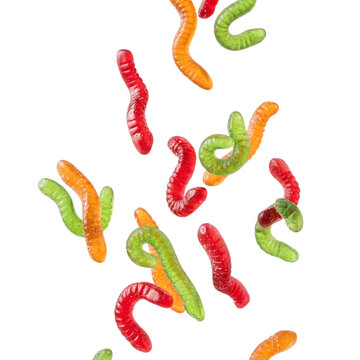 Colorful gummy worms scattered with vibrant colors scattered on transparent background