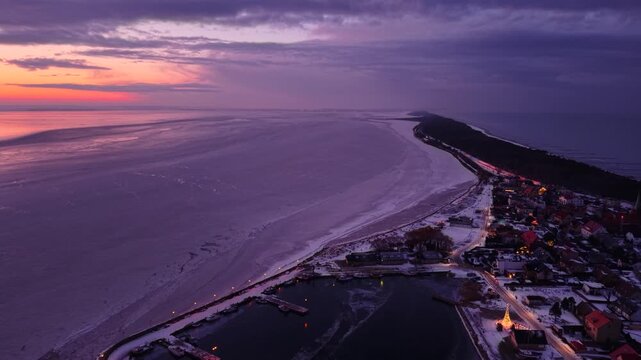 Frozen Bay of Puck near Kuznica at sunset, Hel Peninsula. Poland