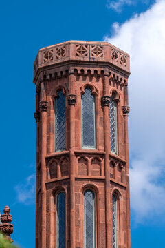 Red sandstone tower details define Smithsonian Castle architecture in Washington, DC.