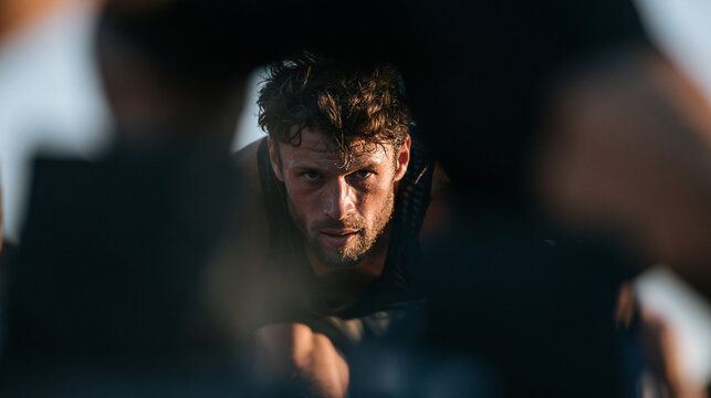 Intense Sweaty Male Athlete Looking Forward with Determination