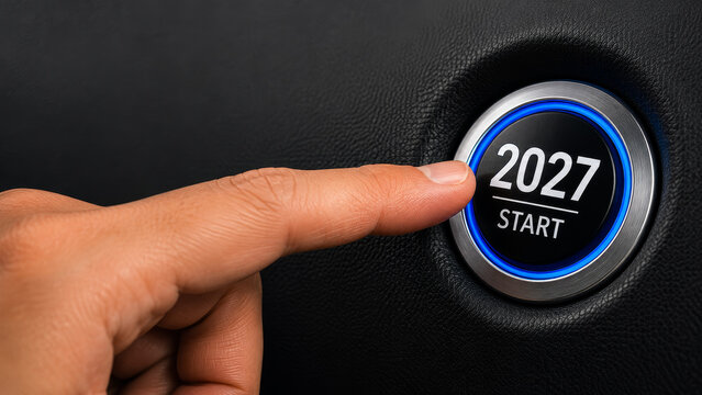 2027 start button pressed by hand for New Year goals, business motivation, achievement, automotive industry and new goal