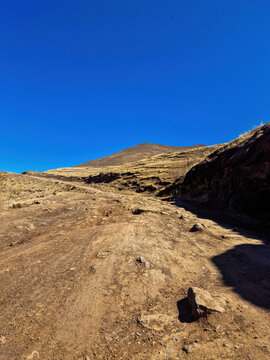 Road crossing Lesotho mountains. Road conditions can be rough and demanding