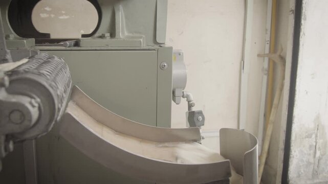 Industrial tortilla machine pressing and shaping tortilla dough