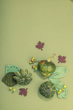 Autumn cozy composition. Crocheted leaves, pumpkins, berries, handmade, fall hobby concept
