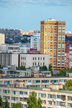 Modern city skyline panorama with residential apartment buildings under blue sky.
