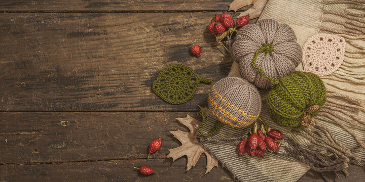 Autumn cozy mood composition. Crocheted pumpkins, handmade, fall hobby concept