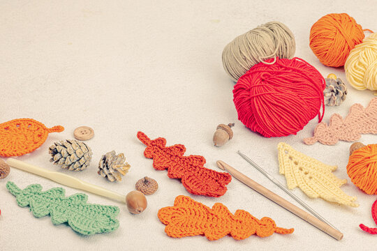 Set of clew of thread for knitting. Crocheted different leaves, handmade, autumn hobby concept