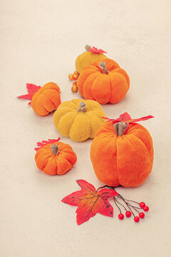 Halloween craft concept. Soft sewed pumpkins, creative process, professional tools and materials